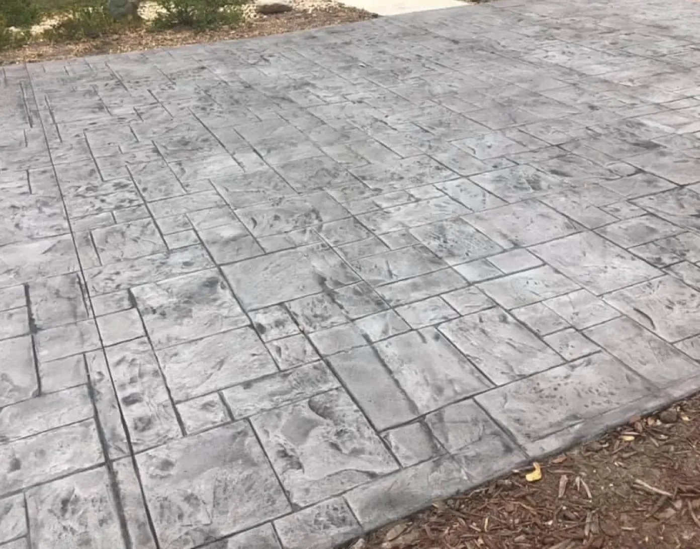 Gray ashlar slate stamped concrete driveway in Brevard County