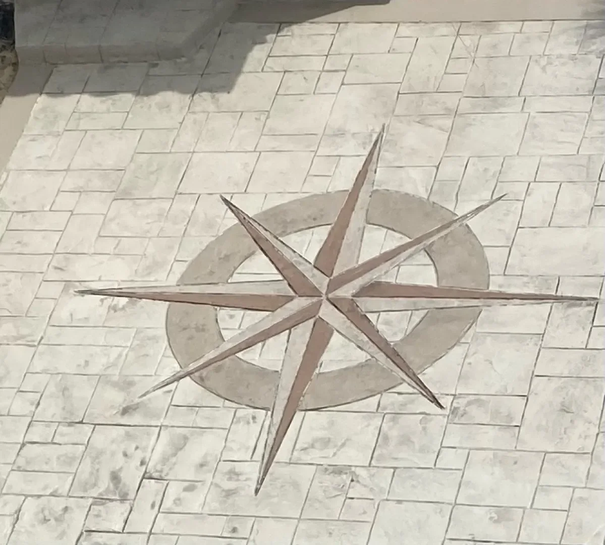 Hand-carved compass star in a stamped concrete patio, Brevard County FL