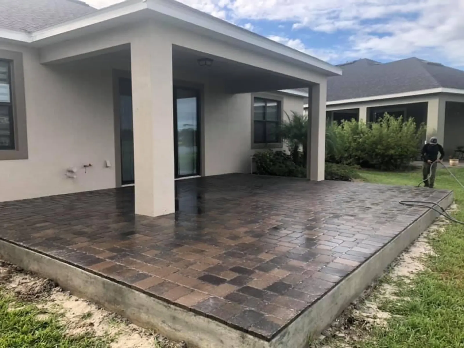 Multi tone paver patio under a covered porch in Brevard County